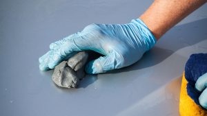 Clay bar being used on car's paintwork